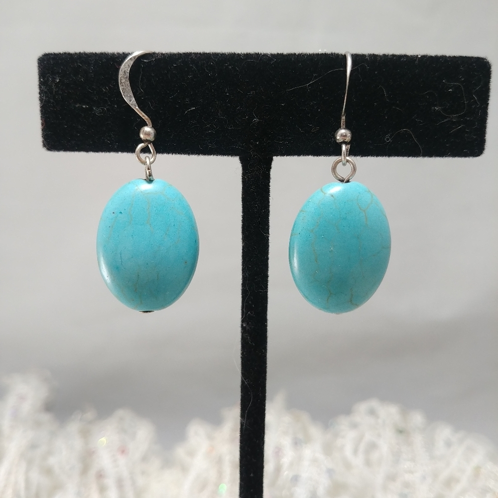 Turquoise colored oval earrings